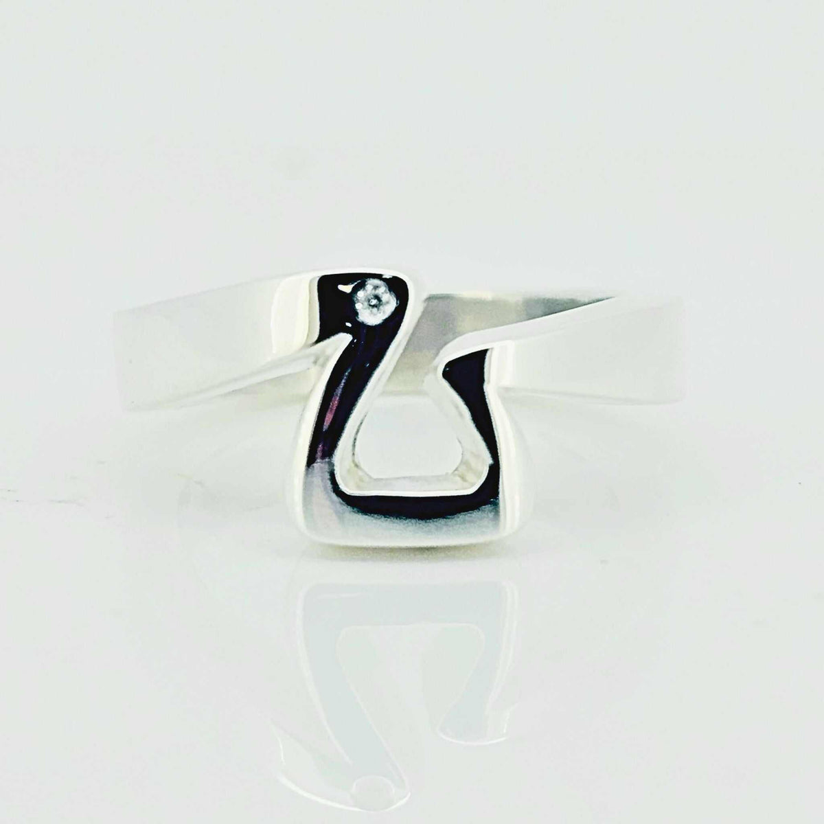 Sterling silver jump stirrup ring flat lay product shot - Crawford Equestrian Jewellery