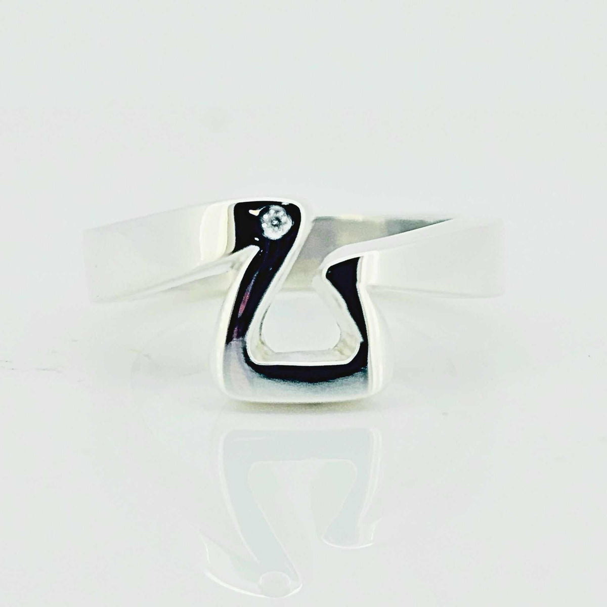 Equestrian Ring in polished sterling silver, shaped like a modern stirrup with a small clear stone accent