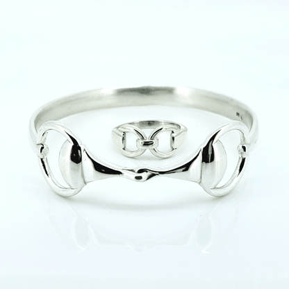 Product photo of Crawford Equestrian Jewellery sterling silver Snaffle Bit Ring and Snaffle Bangle laid flat together, showing the matching equestrian jewellery set.