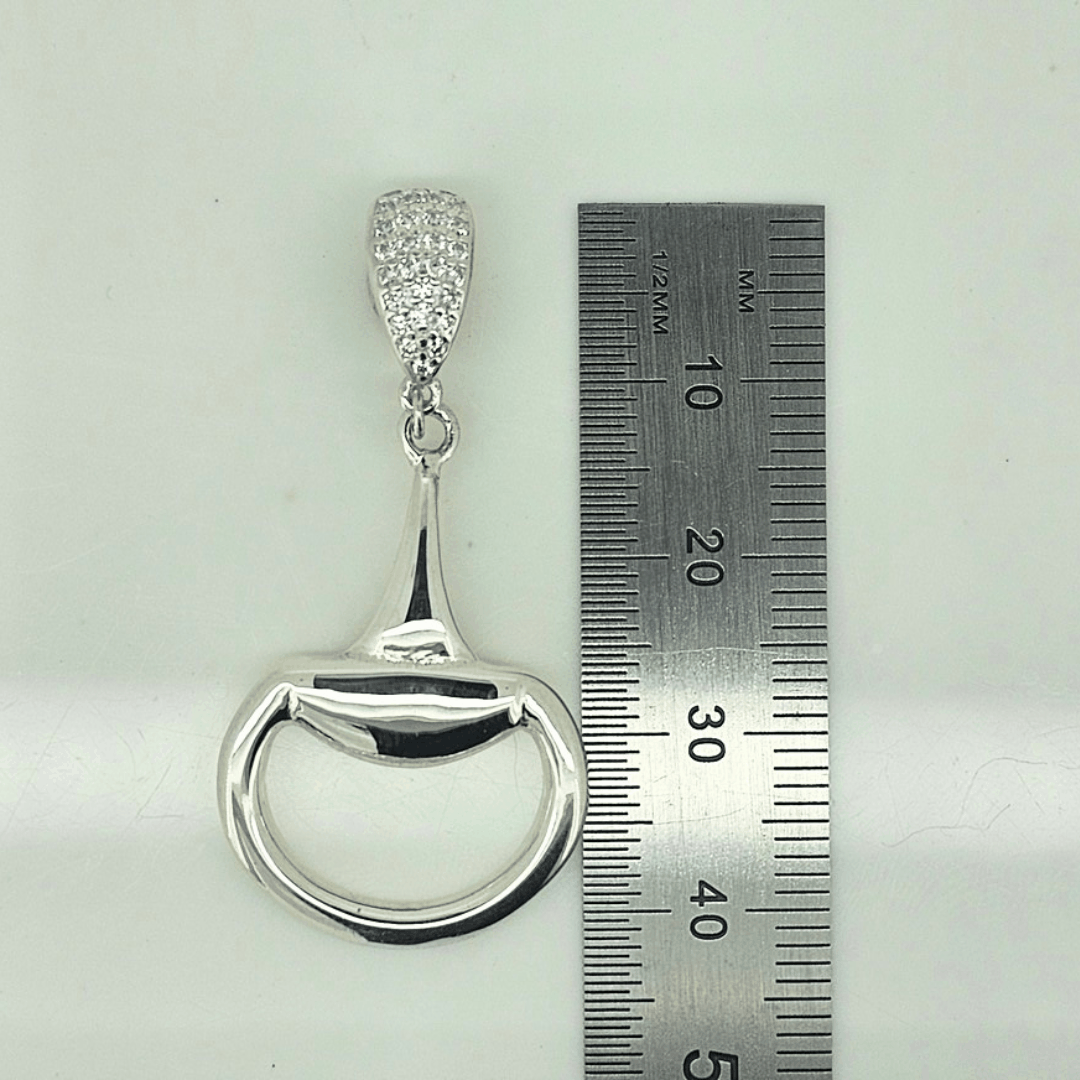 Equestrian Pendant in polished sterling silver, shaped like a half snaffle with a pavé cubic zirconia bale