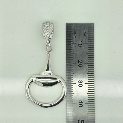 Equestrian Pendant in polished sterling silver, shaped like a half snaffle with a pavé cubic zirconia bale