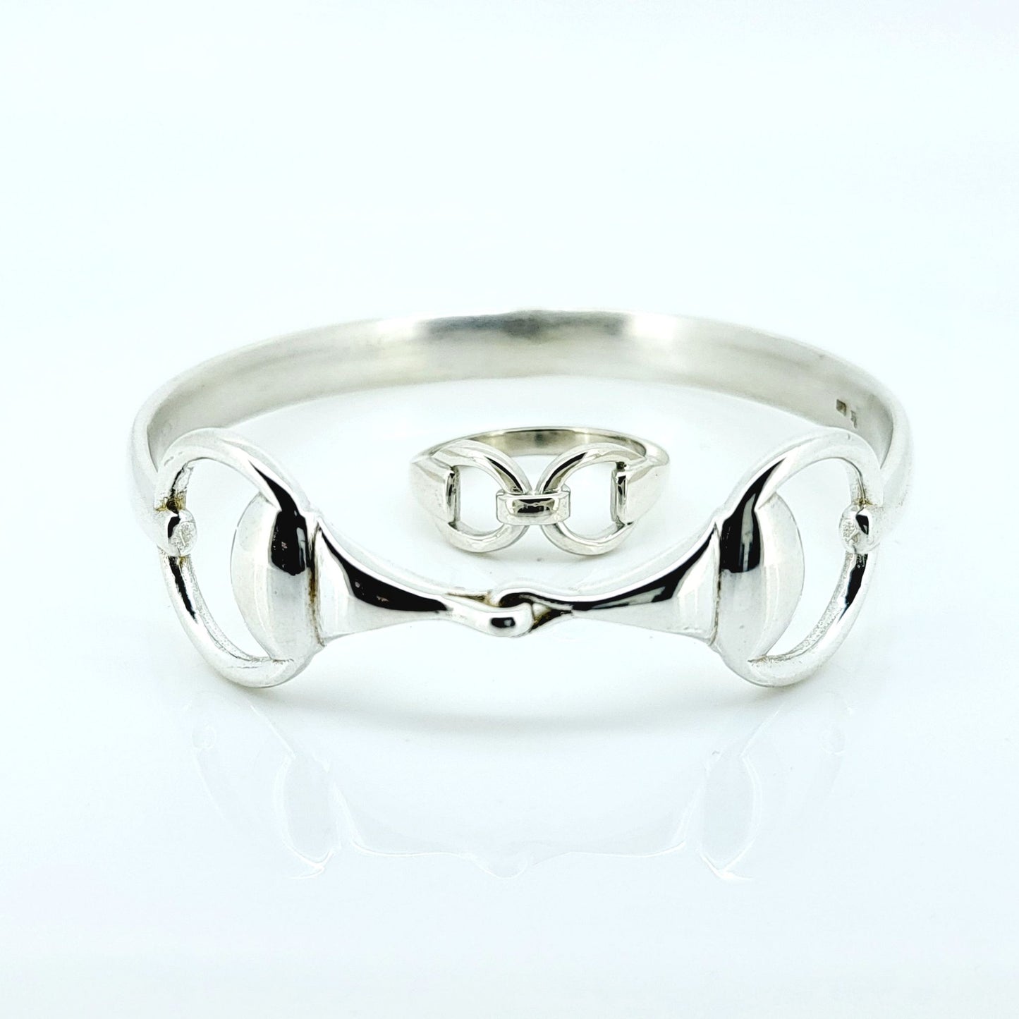 Photo of a silver horse bit snaffle bangle and ring, made by Crawford Hill Equestrian Jewellery. 