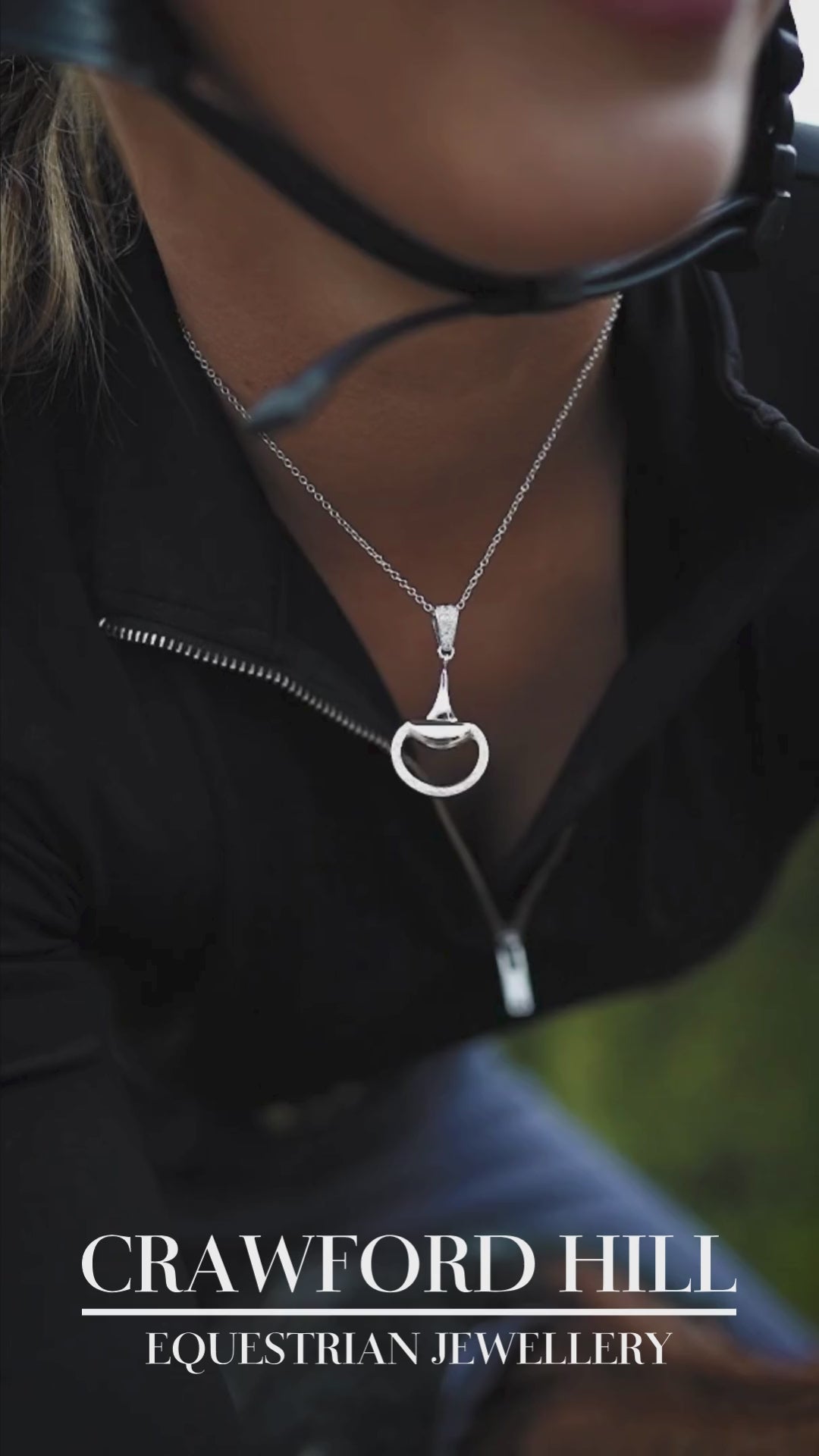 Video of an equestrian horse rider earing a white gold, diamond set half snaffle horse bit necklace by Crawford Hill Equestrian Jewellery. 