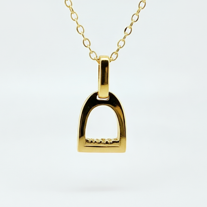 Product photo of small yellow gold stirrup necklace. Made to be worn by horse riders by Crawford Hill Equestrian Jewellery.