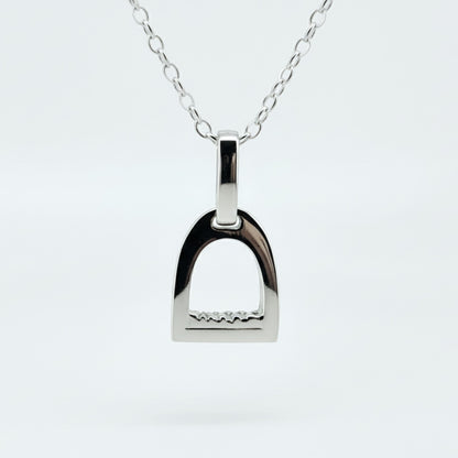 Product photo of small white gold stirrup necklace. Made to be worn by horse riders by Crawford Hill Equestrian Jewellery.